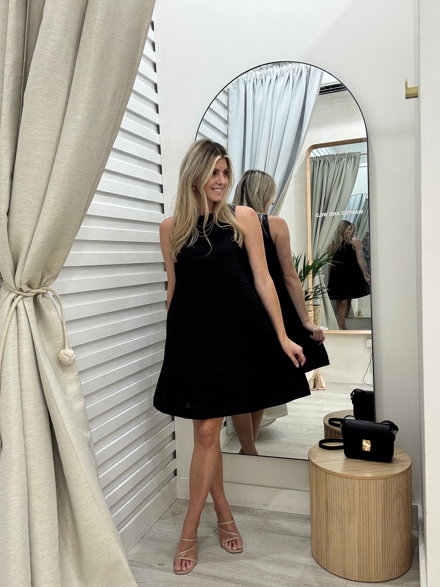 The Atlas Dress in black linen is a wardrobe staple. In a classic A line shape and great length, its perfect for work or casual lunches.