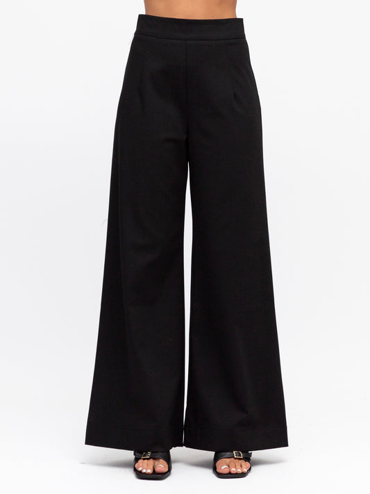 Front view of the luxe suit pants in black by White closet at Wanted and Wild.