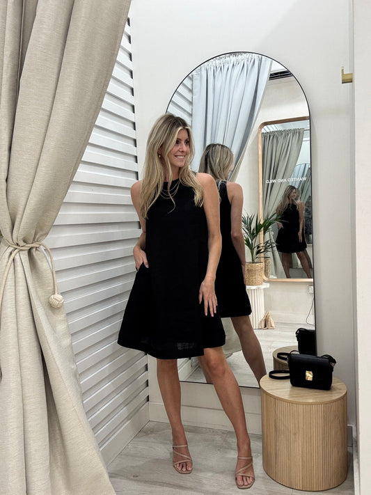 Atlas A-line Dress in black linen with pockets. The perfect length for work.