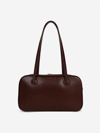 Brown handbag on a light gray background