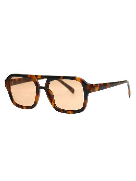 Sunglasses with tortoiseshell frame and beige lenses on a white background