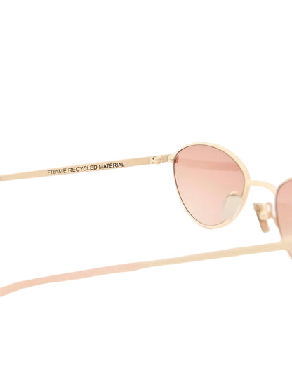Gold-framed sunglasses with pink lenses on a white background